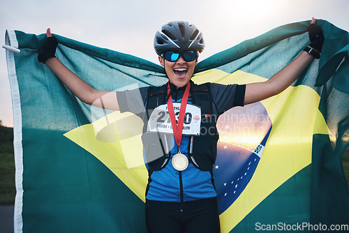 Image of Winner sports, happy woman from brazil with flag and gold medal winning athlete, outdoor cycling race or triathlon. Happiness, win and cyclist with smile, fitness and world record with national pride