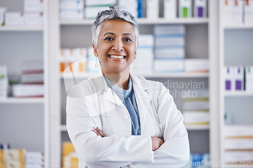 Image of Senior woman, pharmacist and arms crossed in portrait for healthcare, medicine or entrepreneurship at store. Female pharma expert, happy and excited face for small business, service and wellness shop