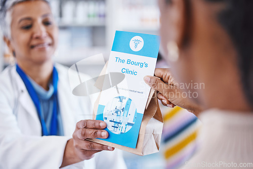 Image of Consulting pharmacist, prescription drugs in package and advice on health care, medicine and insurance. Healthcare, pharmacy and woman consultant at clinic with medical information with pills in bag.