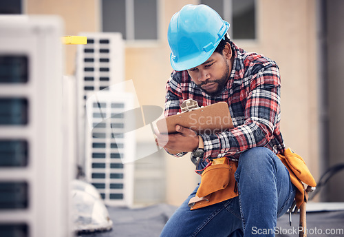 Image of Engineer, roof and checklist for air conditioning maintenance, safety and inspection for quality assurance. Black man, aircon and clipboard for writing report, focus and document for hvac engineering