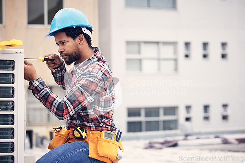 Image of Black man, electrician and maintenance with engineering and ac repair with handyman working with tools on roof. Fix air conditioner, male technician with screwdriver and power generator with service