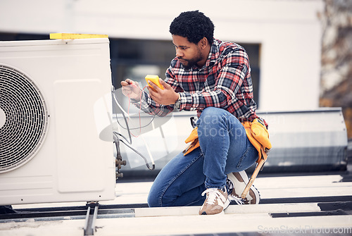 Image of Air conditioner, roof and technician man repair, maintenance and working on electrical power generator. African electrician person, handyman or contractor with electricity, cables check and services