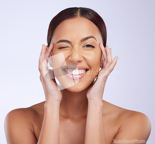 Image of Woman portrait, beauty wink and skincare in a studio with happiness and smile from dermatology. Skin glow, facial and cosmetics of a young female model feeling happy from self care and face wellness