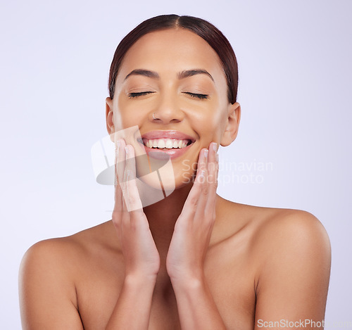 Image of Woman, natural beauty and relax skincare in a studio with happiness and smile from dermatology. Skin glow, facial and cosmetics of a young female model feeling happy from self care and face wellness