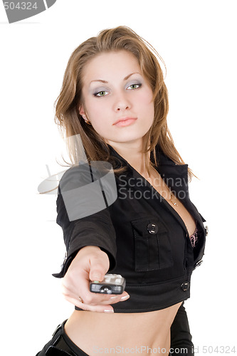 Image of The beauty young woman with remote control