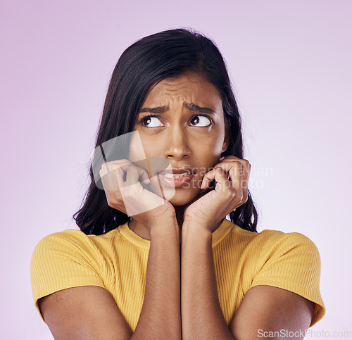 Image of Scared, worry and face of Indian woman on pink background with fear, nervous and confused expression. Stress, anxiety mockup and isolated female with worried, anxious and crisis reaction in studio