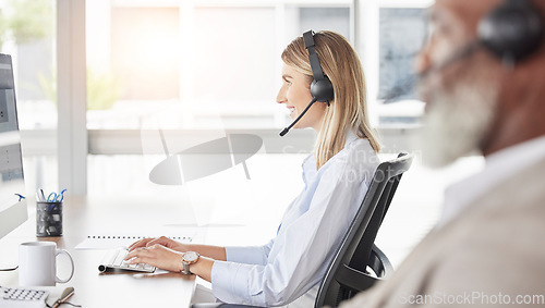 Image of Business woman, call center and consulting on computer for customer service, support or telemarketing at the office. Happy and friendly female consultant agent working on PC for online advice or help