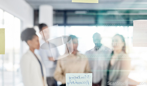 Image of Creative business people, planning and meeting with sticky note for brainstorming, ideas or strategy at office. Group of employee workers thinking in project plan or tasks on glass board for startup