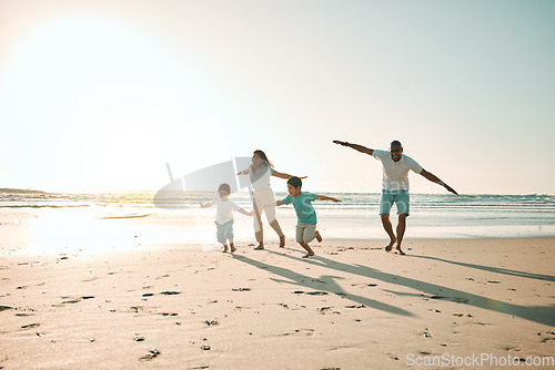 Image of Beach, run and airplane by family playing, freedom and happy along the ocean on blue sky background. flying, game and children running with parents in Mexico for travel, trip and summer vacation