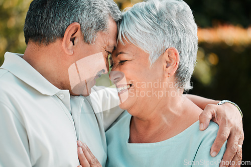 Image of Senior couple, forehead touch and love outdoor in park, garden and nature for hug, care and happiness together. Happy man, woman and retirement with partner, relax and support in marriage for romance