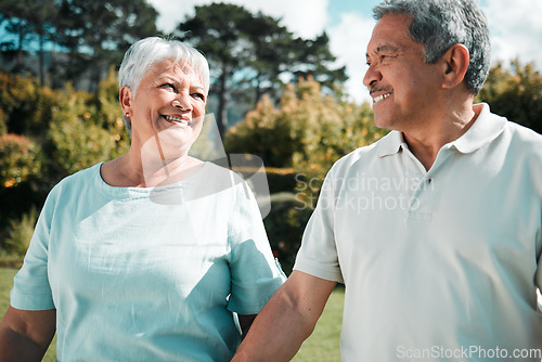 Image of Happy senior couple walking in park, garden and nature of love, care or happiness together. Elderly man, woman and retirement with partner, relax and quality time outdoor in marriage, peace or summer