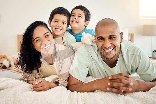 Image of Family, bed and portrait of parents and kids bonding in a bedroom in a house and playing together. Smile, mother and father happy and excited with children in the morning as love and care
