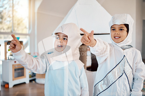 Image of Astronaut, home and children pointing, playing and role play space travel, fantasy games or explore new discovery. Rocket spaceship, creative halloween costume and kids imagine a galaxy adventure