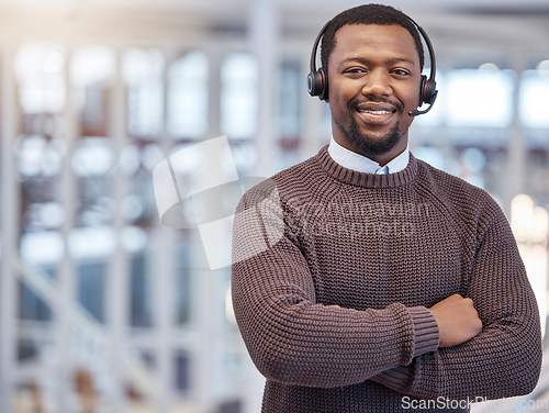 Image of Call center, smile and portrait of black man with arms crossed in office with pride for career, job or customer service. Face, telemarketing and happy, proud and confident sales agent from Nigeria.