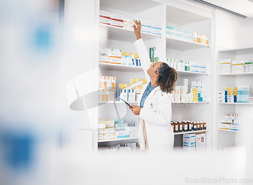 Image of Tablet, pharmacy or woman by shelf with medicine pills or supplements products to check drugs inventory. Blurry, doctor or pharmacist checking boxes of medical stock or retail medication checklist
