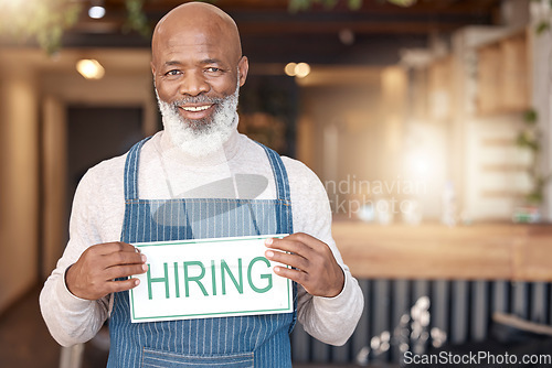 Image of Man, hiring sign and portrait in cafe small business recruitment, hire or job opportunity. Happy African male, senior or coffee shop owner or employer with poster for recruiting or advertising board