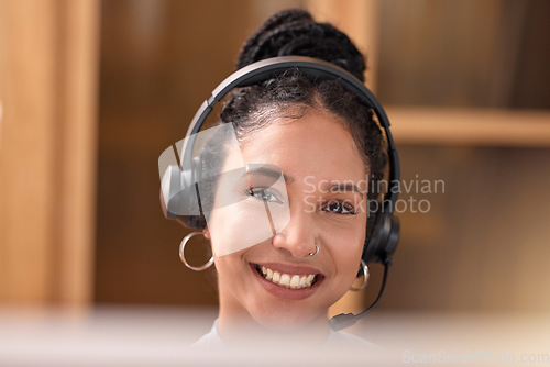 Image of Woman, portrait and face smile in call center with headphones for customer service, support and telemarketing at the office. Happy female consultant, agent and smiling with headset for online advice