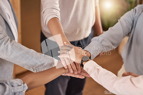 Image of Business people, hands and teamwork in collaboration for meeting, trust or unity and community at the office. Hand of group piling hand together for celebration, success or company goals at workplace