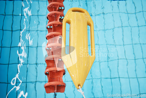 Image of Above, water and a buoy in a pool for safety, life saving and floating help. Board, summer and equipment for protection, security and danger while swimming, rescuing and protecting from drowning