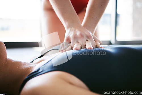 Image of Cpr, hands and chest compression for swimming emergency, drowning and accident with lifeguard. Sports, breathing and resuscitation of woman, rescue of athlete and saving life of swimmer at pool.