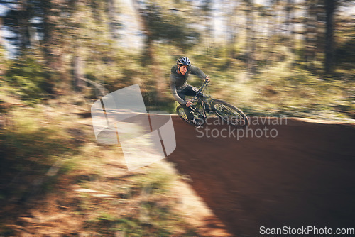 Image of Fitness, fast bicycle and man outdoor on a forest path with extreme and exercise adventure. Bike, cycling and sport of an athlete with speed and nature cycle for sports training and race action