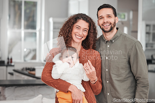 Image of Mom, dad portrait and happiness with baby in a new home together excited. Parent love, smile and papa with happy child in a house kitchen with support and care from father and mother feeling relax