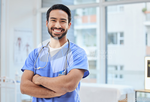 Image of Healthcare, happy doctor and portrait of man in clinic for insurance, wellness and medical service. Cardiologist, hospital and health worker smile with crossed arms for care, consulting and help