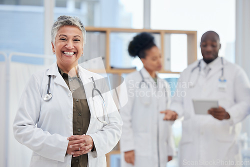 Image of Hospital, doctor and portrait of senior woman in healthcare clinic for insurance, wellness and medical service. Medicine, leadership and female health worker smile for professional care and help