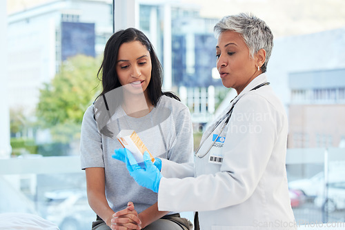 Image of Healthcare, consultation and doctor talking to patient in a hospital explaining medication. Medicine, professional and female medical worker or specialist consulting a woman in a medicare clinic.