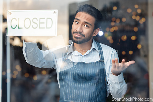 Image of Portrait, business and Asian man with closed sign, coffee shop and closing with recession. Male employee, entrepreneur or manager closing restaurant, financial crisis or bankruptcy with loss of money