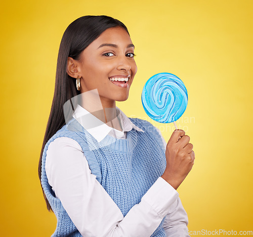 Image of Smile, lollipop and candy with portrait of woman in studio for sweets, snack and food. Treats, dessert and sugar confectionery with female isolated on yellow background for diet, eating and happy