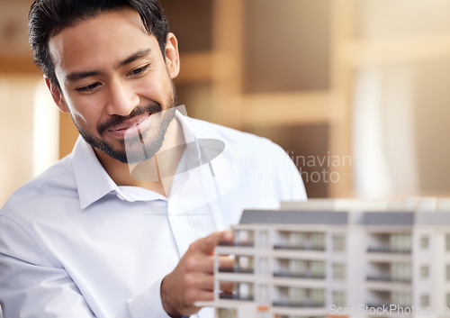 Image of Architect, man and check building model, construction with smile on face and architecture project. Businessman in office, design and engineer with property development company and construction job