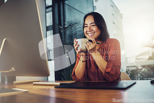 Image of Computer, coffee and happy business woman in office excited for planning, email or design idea. Tea, relax and satisfied smile for female asian entrepreneur reading proposal, plan or startup goal