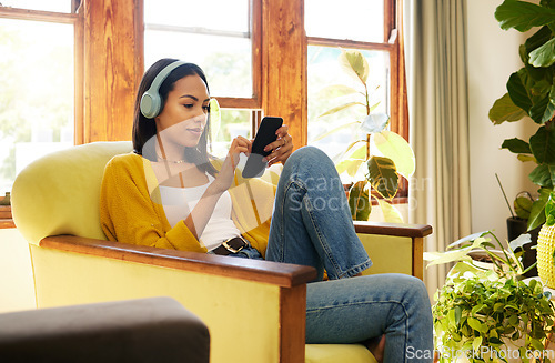 Image of Woman, smartphone and headphones, social media and listening to music with communication and technology. Online chat, female relax at home with mobile app and podcast, games and scroll internet