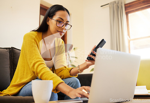 Image of Laptop, remote worker and woman with phone in home living room for typing. Freelancer, computer or person with cellphone for working, email or research for online browsing, web scrolling or multitask
