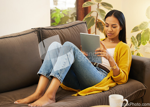Image of Relax, social media and woman on couch, tablet and watching videos in living room, break and chilling. Female, device and person on sofa, online reading and connection in home and searching internet