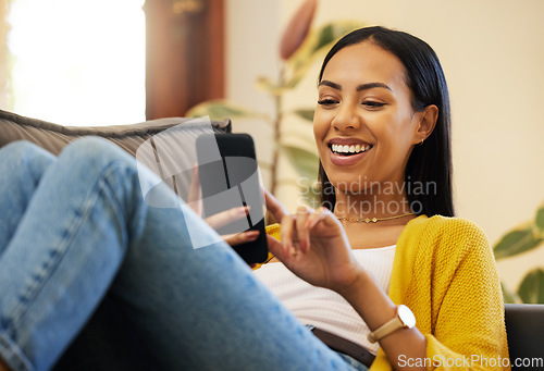 Image of Phone, relax and woman laughing in home living room on sofa, social media or funny meme. Cellphone, comedy and happy person web scrolling, online browsing or text messaging for comic joke in house.