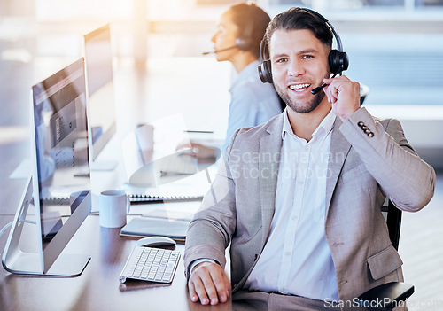 Image of Man, call center and microphone with smile in office for crm, contact and customer service job. Consultant, happiness and listening on voip call for tech support, advice or telemarketing in workplace