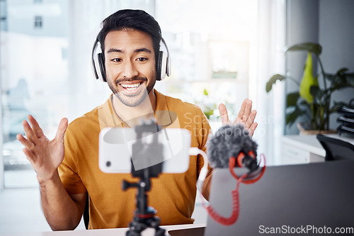 Image of Podcast, happy and live streaming with a man content creator recording a broadcast in his home office. Internet, freelance and subscription with a male vlogger or creator working in his studio