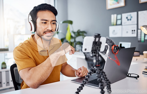 Image of Podcast, streamer and live broadcast with a man influencer recording tutorial content in his home office. Internet, freelancer and subscription with a creative male vlogger working in his studio