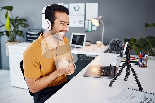 Image of Podcast, smile and live stream with a man influencer recording broadcast content in his home office. Internet, freelance and subscription service with a male vlogger or creator working in his studio