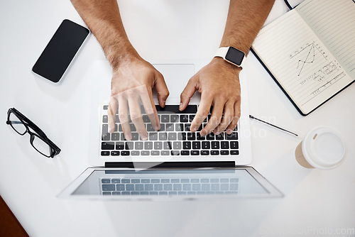 Image of Laptop, notebook and hands of a man typing while working on a corporate project in the office. Technology, keyboard and top view closeup of a professional male doing research for report in workplace.