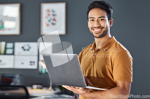 Image of Portrait, laptop and happy man in office smile, confident and excited against blurred wall background. Face, smile and asian businessman online for planning, goal and design agency startup in Japan