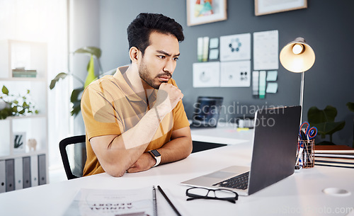 Image of Thinking, laptop and business man with online research, website design planning and working in creative office. Focus, serious and designer or asian person on computer with project decision or ideas