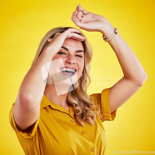 Image of Smile, shy and hide with portrait of woman in studio for cover, freedom and surprise. Happy, announcement and celebration with female isolated on yellow background for hiding, excited and wow