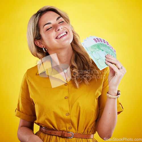 Image of Smile, rich and woman with cash, winning and wealthy lady against a studio background. Female person, happy model or winner with money, happiness or excited for finance bonus or competition giveaway