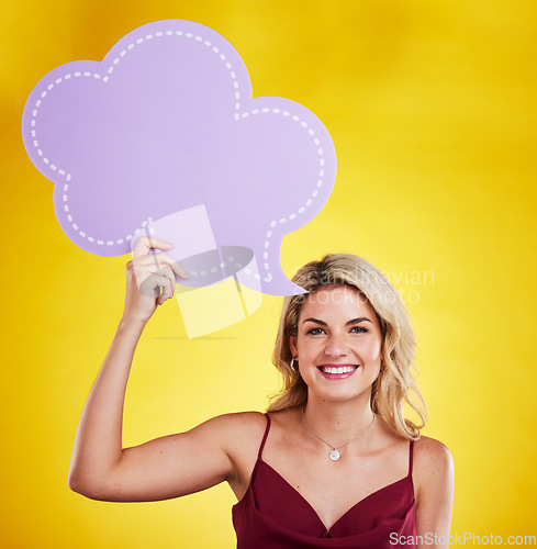 Image of Portrait, smile and woman with speech bubble for social media in studio isolated on a yellow background. Poster, mockup and happy female person with advertising banner, marketing opinion and voice.