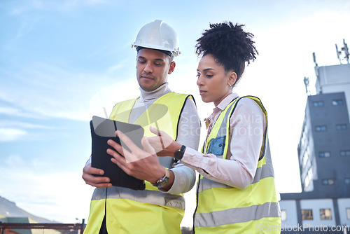 Image of Architect, tablet and construction in planning, idea or collaboration for project plan in the city on site. Man and woman contractor working together on technology for architecture ideas or building