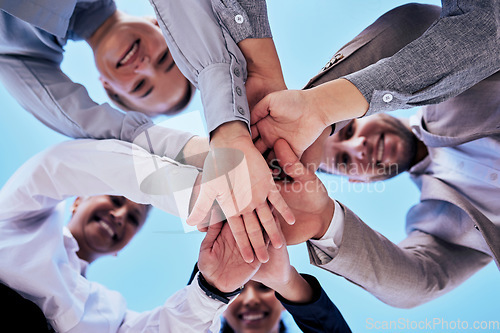 Image of Business people, hands together and teamwork in unity below blue sky for agreement or collaboration outdoors. Group of employee workers piling hand in team building, motivation or meeting for support