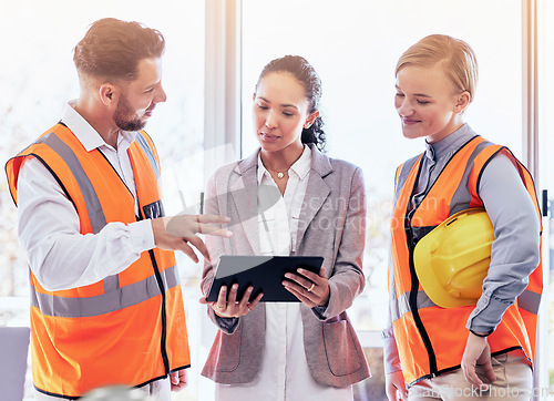 Image of Business people, architect and tablet in meeting for idea, brainstorming or planning for construction at the office. Engineering group in teamwork collaboration for architecture plan on technology